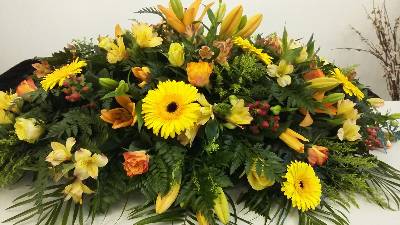 Orange Lilies with yellow and orange flower Coffin Spray